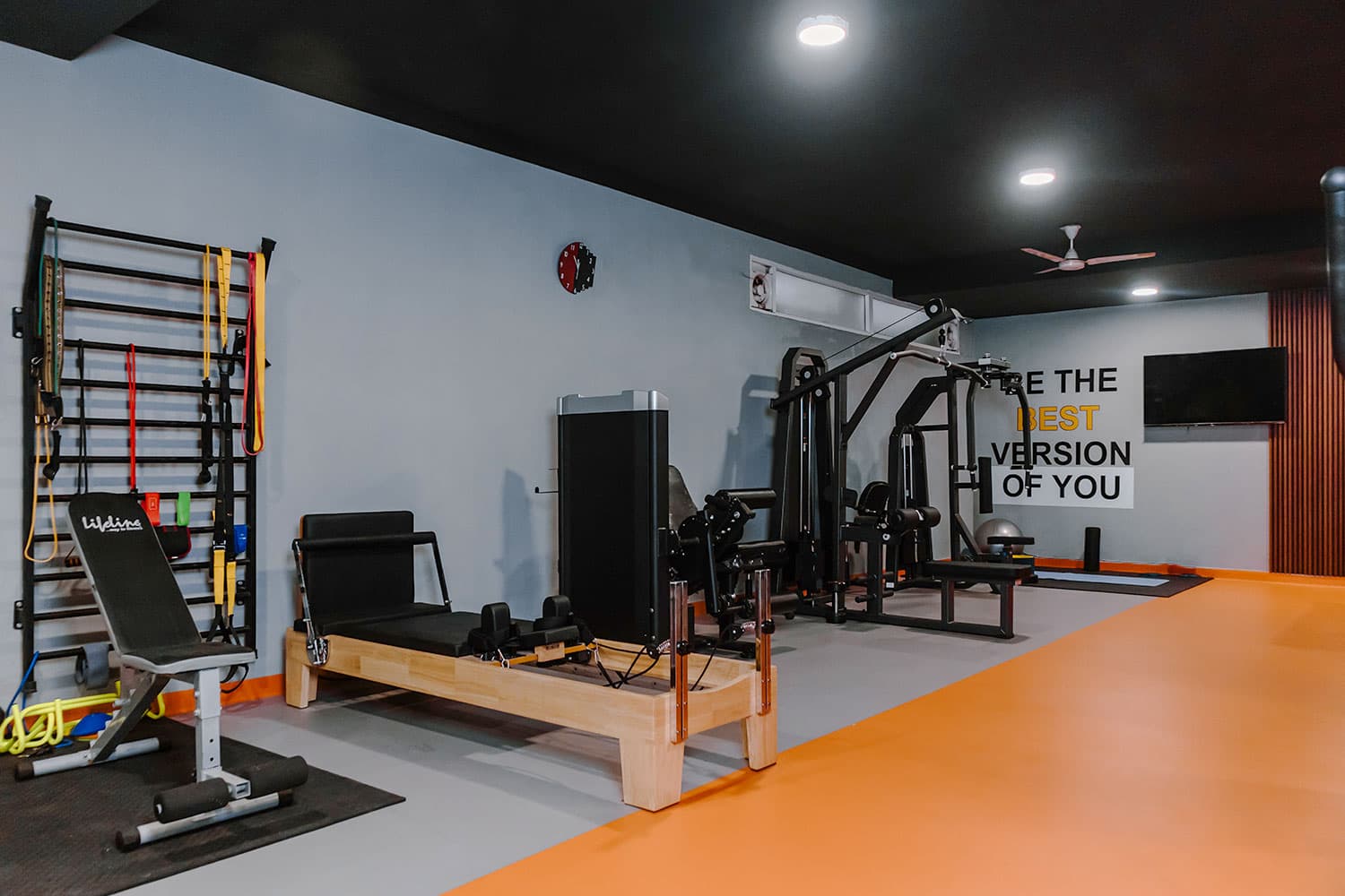 Fitness studio with Pilates reformer, wall bars and strength machines